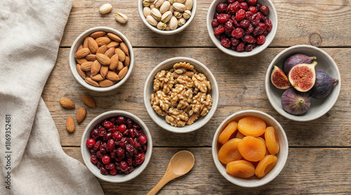 Assorted Nuts and Dried Fruits on Wooden Surface