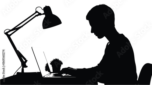 Silhouette of man working on laptop computer at desk with lamp, office workspace, professional, businessman, technology