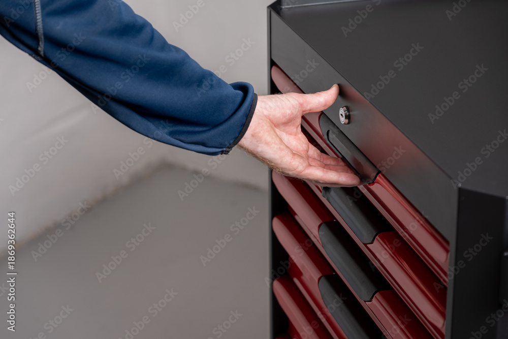 Naklejka premium Closing tool cabinet drawer