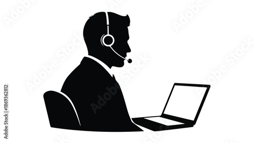 Businessman customer service representative wearing headset working on laptop computer in office setting for call center or support team
