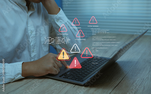 Obraz na płótnie Business user facing system warning alerts error icons on laptop screen, symbolizing cybersecurity risk, software failure, data protection issues and digital technology problems