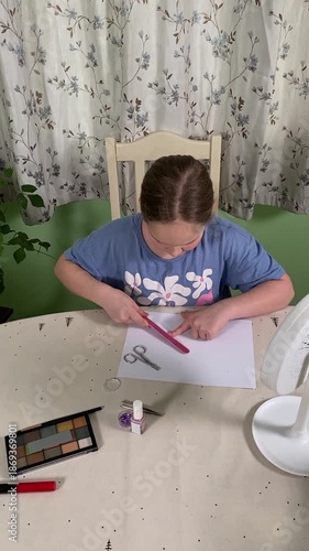 Teenage girl learning to apply makeup at home, using cosmetics with curiosity and care. Exploring beauty and self-care from a young age, she practices in a relaxed and familiar environment. 