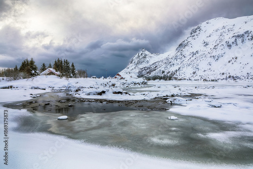 Wallpaper Mural Amazing winter scenery with snowy  mountain peaks  on the shore of Rolvsfjord on Vestvagoy island at Lofotens. Torontodigital.ca