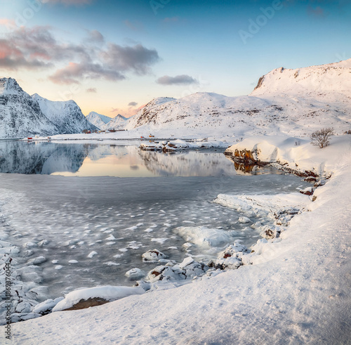 Wallpaper Mural Flakstadpollen and Boosen fjords with cracks on ice during sunrise with Hustinden mountain on background. Torontodigital.ca