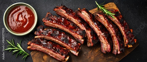 Deliciously glazed ribs served on a wooden board with barbecue sauce and fresh herbs, creating a mouthwatering culinary presentation.