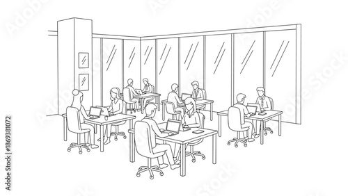 Modern office workspace with professionals working on laptops in open plan layout