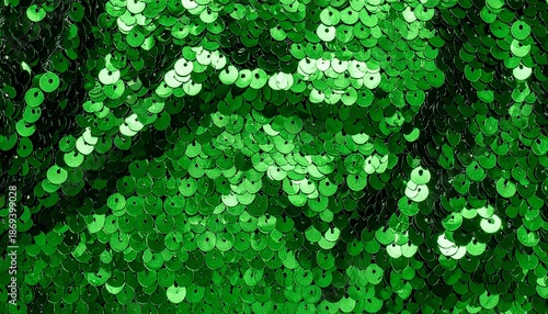 Green sequins are used to create an abstract festive background for party and holiday banners. gorgeous, glossy background with blinking lights and a sequin feel. Green-colored sequin fabric
