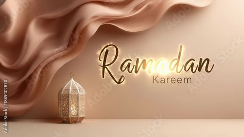 Elegant lantern beside flowing fabric with glowing text 'Ramadan Kareem' on a soft, muted background