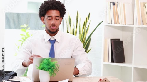 businessman in office with laptop, relaxing