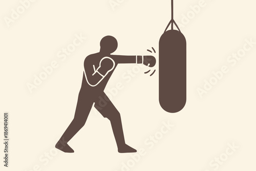 Silhouette of a boxer punching a heavy bag in training.