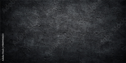 Aged dark grunge concrete wall background featuring a rough vintage stone texture and dirty gray surface with blank copy space for design