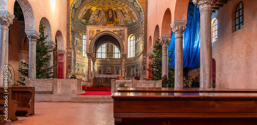 Wide interior view of the Euphrasian Basilica showing marble columns, arches and detailed apse mosaics, Poreč, Croatia