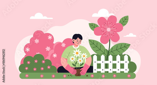 Happy young person holding a pot of daisies while gardening.