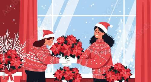 Two women in festive Christmas sweaters arranging red poinsettia flowers.