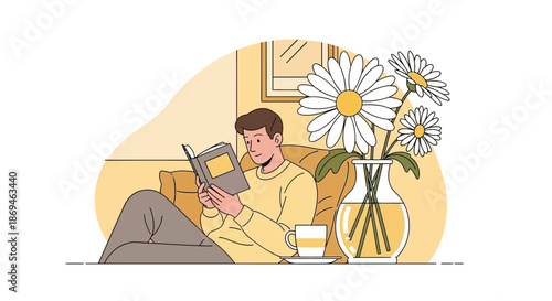Young man relaxing comfortably while reading an interesting book at home.