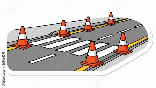 Orange traffic cones mark a pedestrian crossing on a road