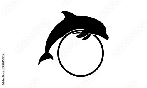 Black silhouette of a playful dolphin leaping through a circular hoop, symbolizing marine agility and entertainment