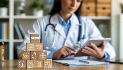 Non Communicable Diseases NCDs Medical Concept with Doctor and Wooden Blocks