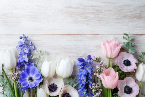 Spring Flowers Arrangement on White Wood Background