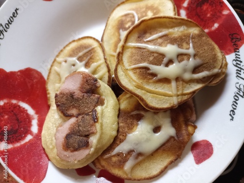 Appetizing breakfast. pancakes on a plate with cheese. Hot food.