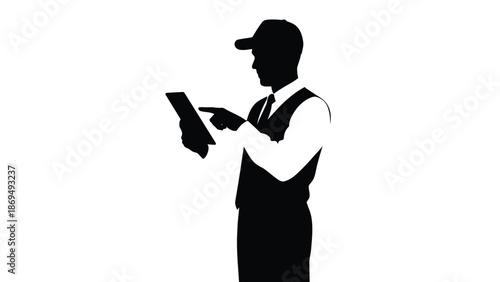 Silhouette of a man in a vest and cap pointing at a digital tablet screen for service