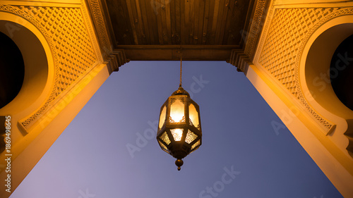 moroccan lantern hanging from archway ceiling