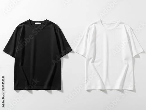 Black and white tshirts side by side on gray background for design