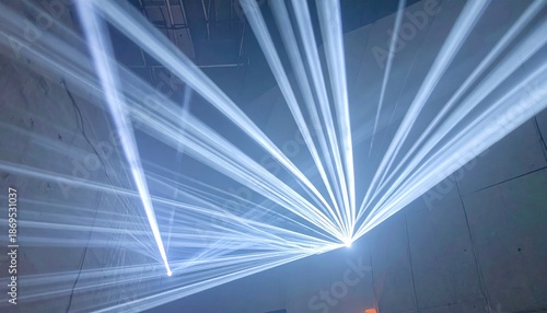 Dynamic Laser Light Show Displaying Bright Beams in Dark Atmosphere.