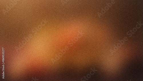 An abstract composition featuring a blurred gradient of warm orange and brown hues with subtle textural variations throughout the frame