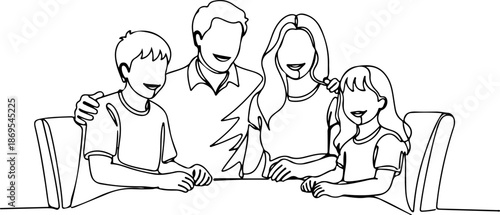 Happy family sitting together at the table