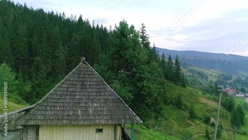 House in countryside area with green forest around