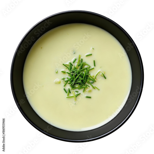 Vichyssoise soup creamy potato leek bowl with chive garnish top view minimal style