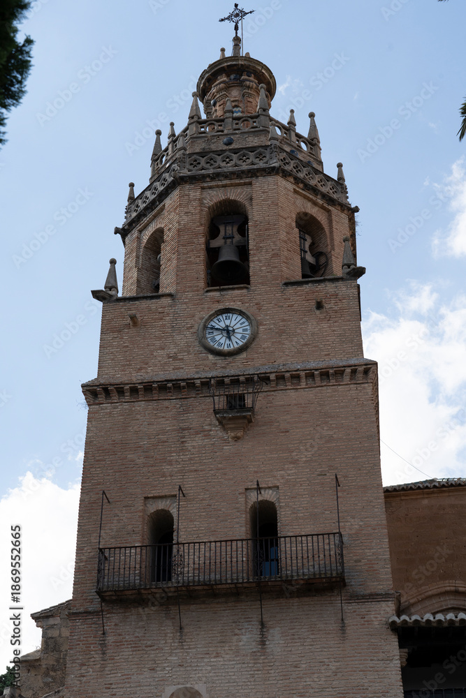 Obraz premium Historic clock tower with intricate architectural details.. Ronda, Málaga, Spain