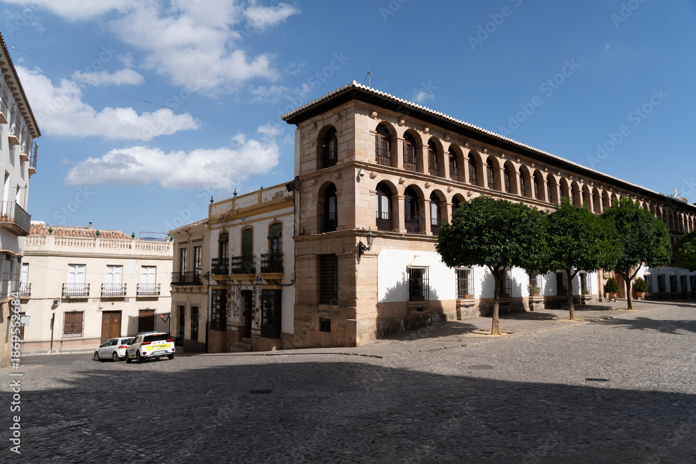 Obraz premium Historic buildings and cobblestone street in Ronda.. Ronda, Málaga, Spain
