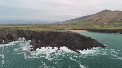 Scenic 4K aerial video of flying above spectacular Atlantic coastline, with picturesque rocks, cliffs and islands, Sybil head, Dingle Peninsula, Kerry, Ireland