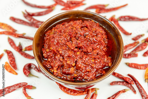 Dried chili peppers and broad bean paste served in a porcelain bowl