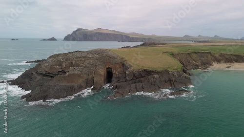 Scenic 4K aerial video of flying above spectacular Atlantic coastline, with picturesque rocks, cliffs and islands, Sybil head, Dingle Peninsula, Kerry, Ireland