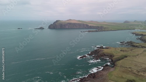 Scenic 4K aerial video of flying above spectacular Atlantic coastline, with picturesque rocks, cliffs and islands, Sybil head, Dingle Peninsula, Kerry, Ireland