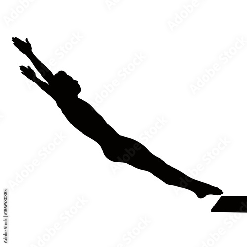 Silhouette of a swimmer diving from a starting block.