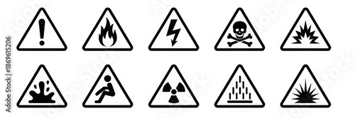 Hazard and warning signs with various danger symbols including toxic, flammable, electrical, biohazard, explosion, slipping and chemical risks shown inside triangular caution shapes – stock
