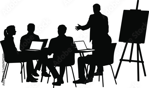 Four people sitting with laptops and one standing with an easel in a meeting setting business
