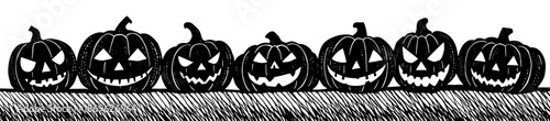 Jack-o'-lanterns lined up in black and white