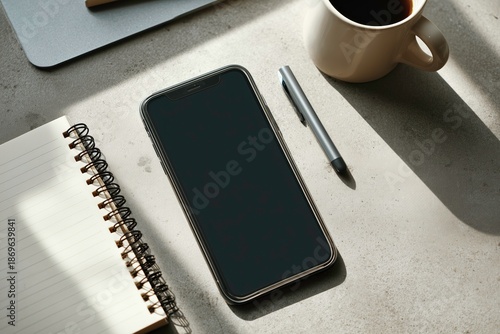 flat lay, smartphoneand paper notebook on modern desk, minimal business workspace, natural light