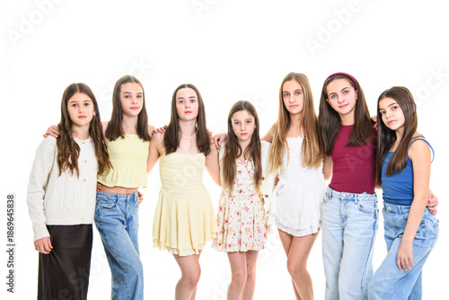 Group Of Teenage Girlfriends on studio white background