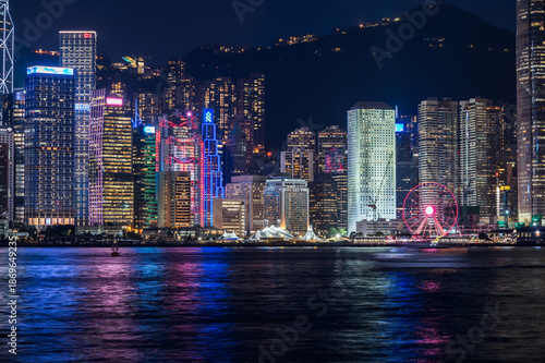 Wallpaper Mural Evening view of Hong Kong from Kowloon. Kowloon's waterfront, boats, skyscrapers, lights, ferries. Hong Kong, China. 23 May 2025 Torontodigital.ca