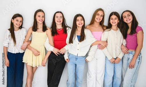Group Of Teenage Girlfriends on studio white background