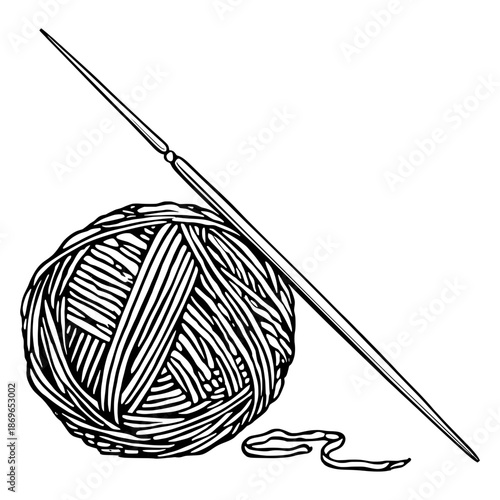 Knitting tools with yarn and a needle on a plain surface