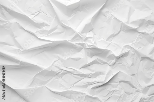 Wallpaper Mural A close-up of crumpled white paper showcasing various textures and folds, creating a dynamic, abstract visual effect. Torontodigital.ca