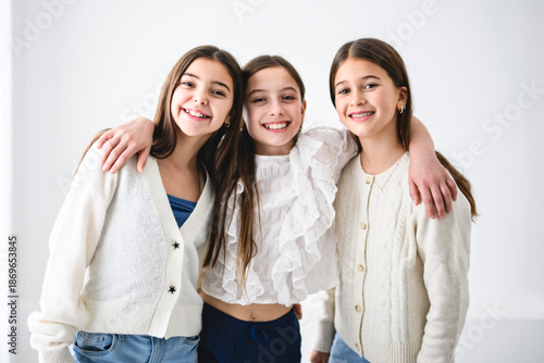 three Teenage Girlfriends on studio white background