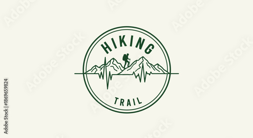 Hiking trail logo with a hiker and mountains in a circular green design element